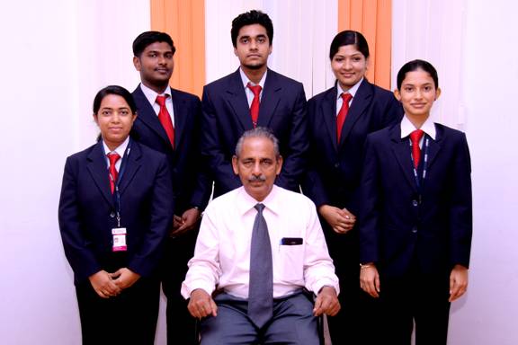 Dr. Rajan Varughese, Director / Principal of MCMAT with the winners of First Prize in All Kerala Management Association (KMA).